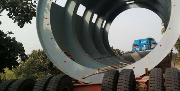 Large fabricated steel pipe and duct sections at an industrial works site